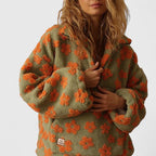 Pull élégant à demi-fermeture éclair et motif floral pour un style sans effort