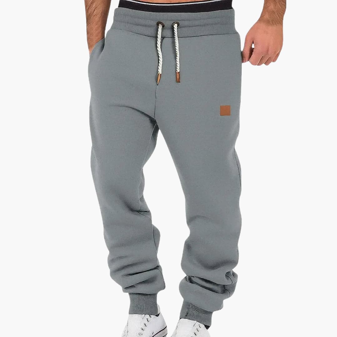Men's tapered joggers with adjustable elastic waistband and side pockets for versatile wear