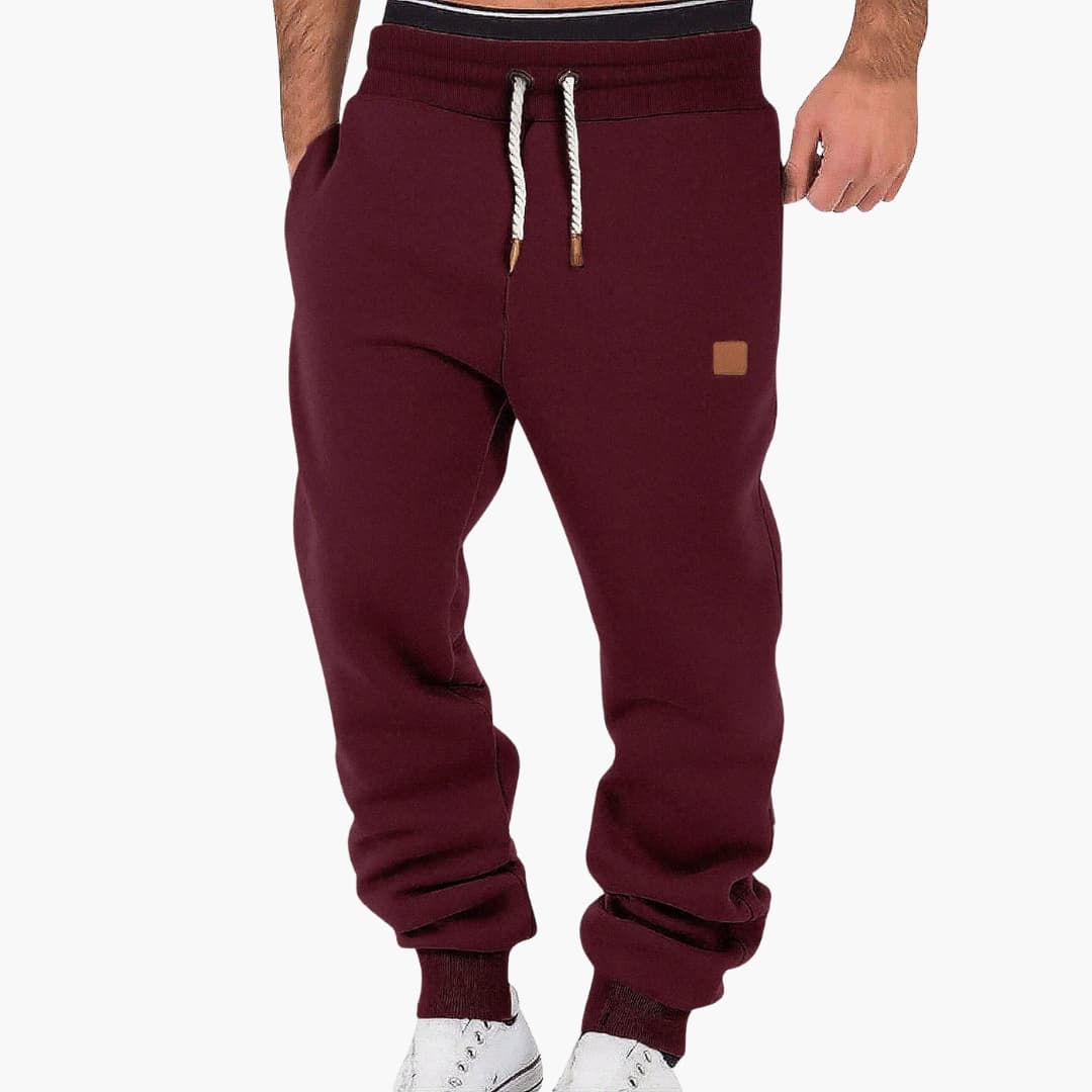 Men's tapered joggers with adjustable elastic waistband and side pockets for versatile wear