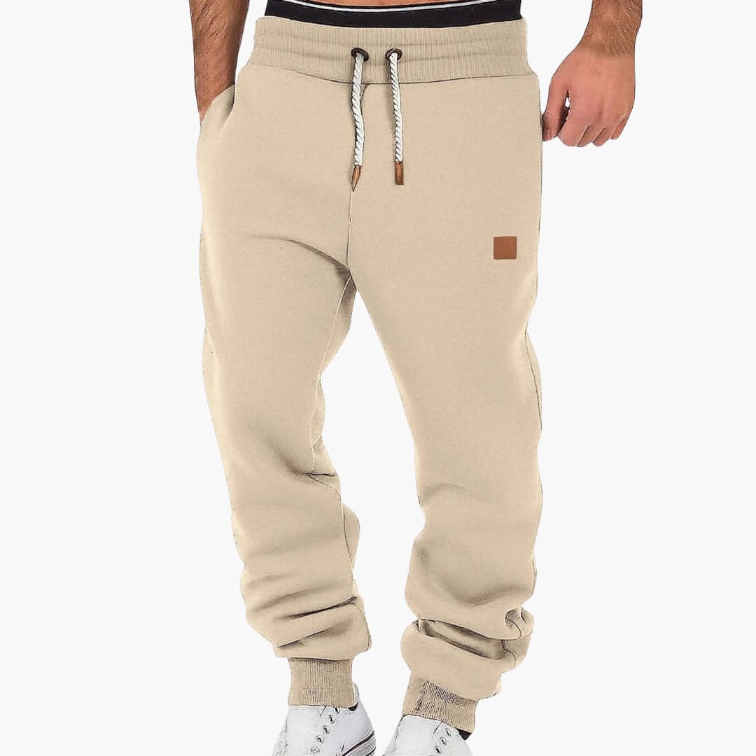 Men's tapered joggers with adjustable elastic waistband and side pockets for versatile wear