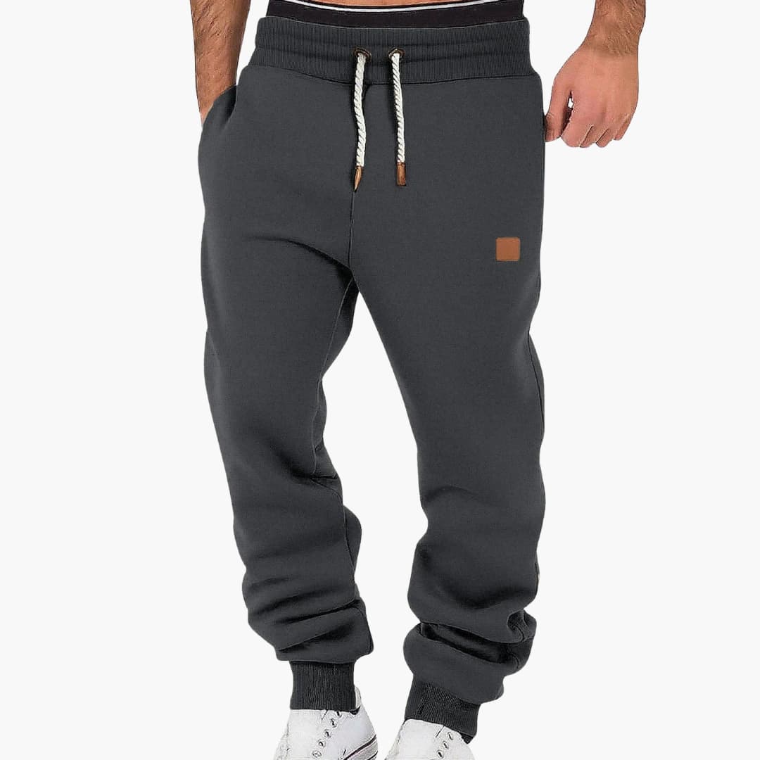 Men's tapered joggers with adjustable elastic waistband and side pockets for versatile wear