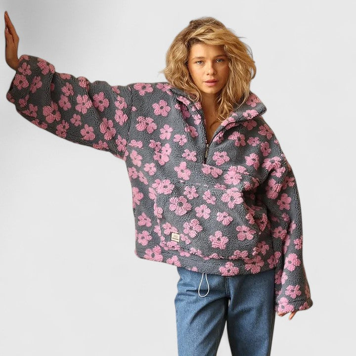 Pull élégant à demi-fermeture éclair et motif floral pour un style sans effort