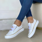 Baskets compensées pour femmes avec garniture métallique et lacets à chaîne