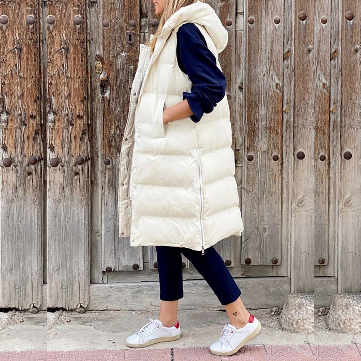Gilet matelassé long pour femme avec capuche et fermeture éclair sur le devant