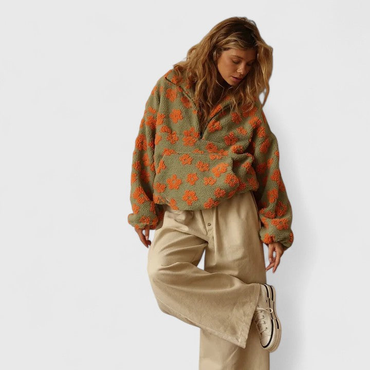 Pull élégant à demi-fermeture éclair et motif floral pour un style sans effort