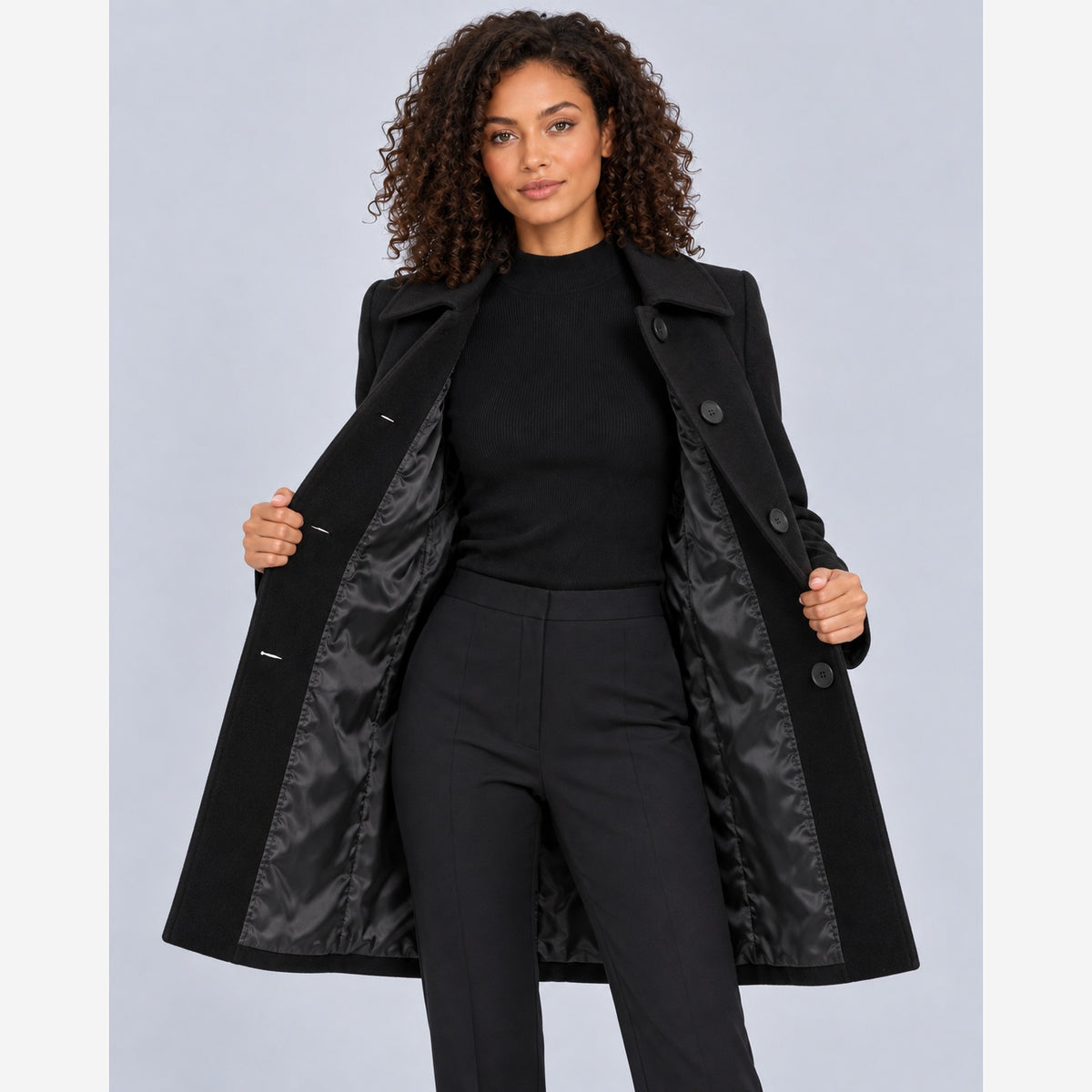 Women's fit and flare coat in Black showing lined interior