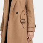 Manteau long pour femme à col montant, boutonnage sur le devant et taille ceinturée