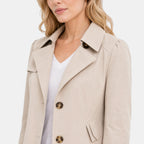 Trench-coat pour femme avec col classique, fermeture boutonnée et ceinture à la taille